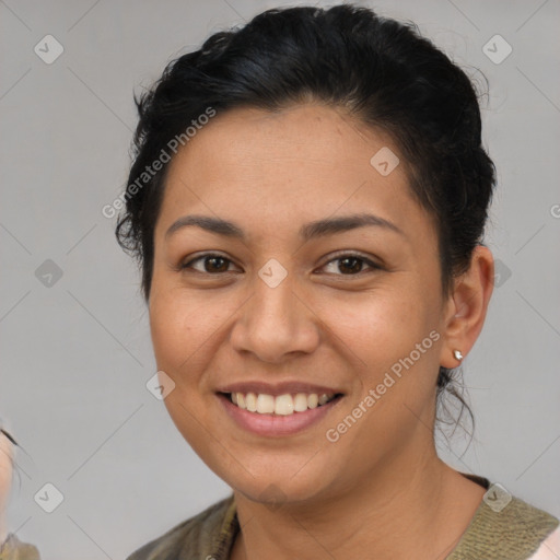 Joyful latino young-adult female with medium  brown hair and brown eyes