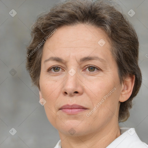 Joyful white adult female with short  brown hair and brown eyes