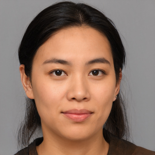 Neutral asian young-adult female with medium  brown hair and brown eyes