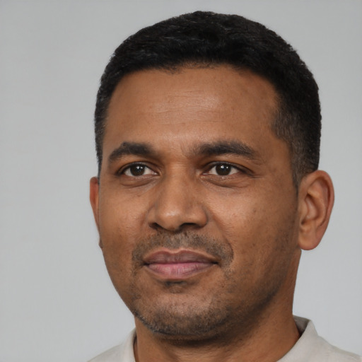 Neutral latino adult male with short  black hair and brown eyes