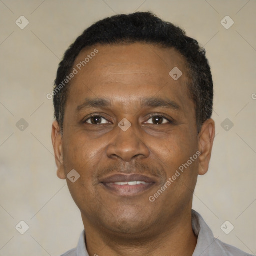 Joyful latino adult male with short  black hair and brown eyes