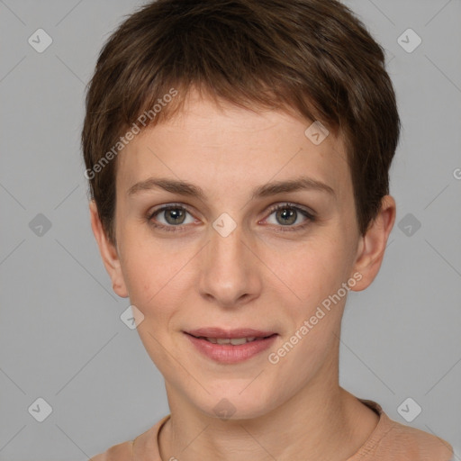 Joyful white young-adult female with short  brown hair and grey eyes