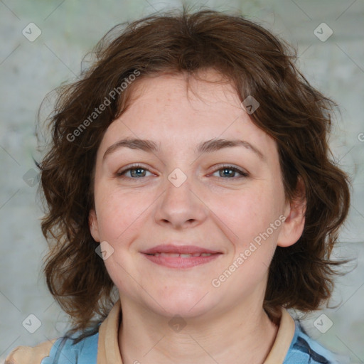 Joyful white young-adult female with medium  brown hair and blue eyes