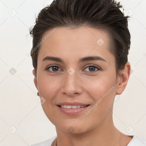 Joyful white young-adult female with short  brown hair and brown eyes