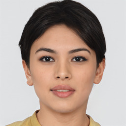 Joyful asian young-adult female with short  brown hair and brown eyes