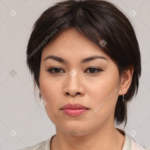 Joyful asian young-adult female with medium  brown hair and brown eyes