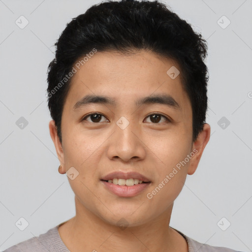 Joyful asian young-adult male with short  black hair and brown eyes