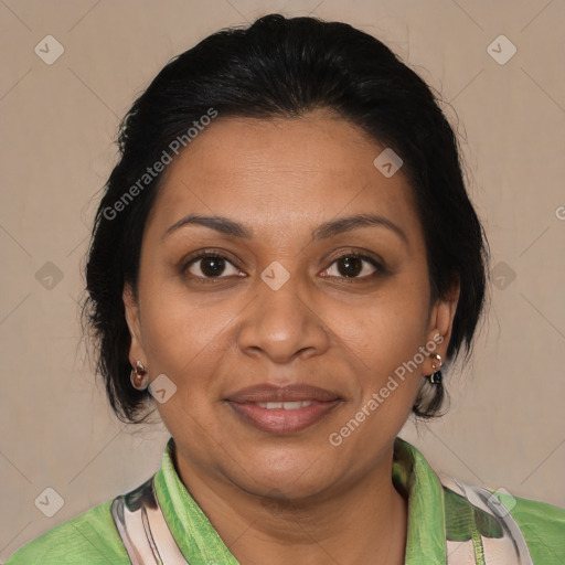 Joyful black adult female with medium  brown hair and brown eyes