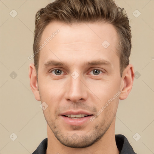 Joyful white young-adult male with short  brown hair and grey eyes