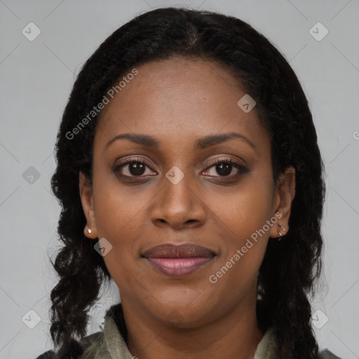 Joyful black young-adult female with long  brown hair and brown eyes