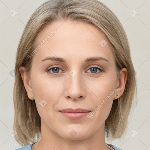 Joyful white young-adult female with medium  brown hair and blue eyes