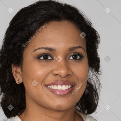 Joyful black young-adult female with long  brown hair and brown eyes