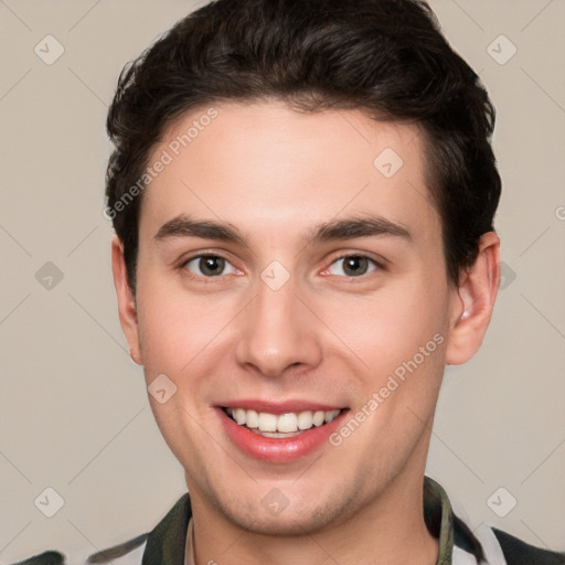 Joyful white young-adult male with short  brown hair and brown eyes