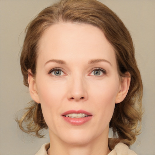 Joyful white young-adult female with medium  brown hair and blue eyes