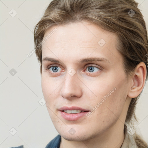 Joyful white young-adult female with medium  brown hair and blue eyes