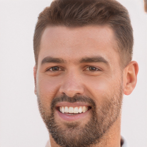 Joyful white young-adult male with short  brown hair and brown eyes