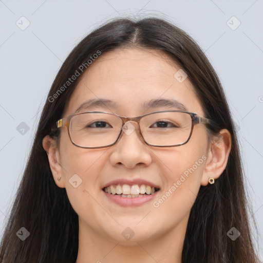 Joyful white adult female with long  brown hair and brown eyes