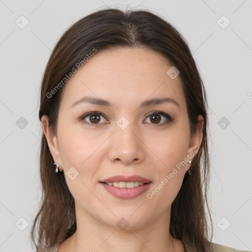 Joyful white young-adult female with long  brown hair and brown eyes