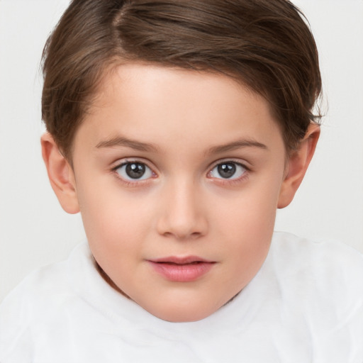 Joyful white child female with short  brown hair and brown eyes