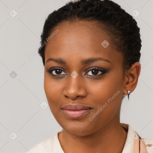 Joyful black young-adult female with short  brown hair and brown eyes