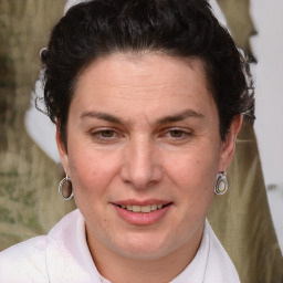 Joyful white adult female with short  brown hair and brown eyes