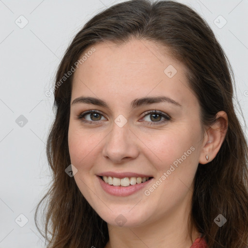 Joyful white young-adult female with long  brown hair and grey eyes