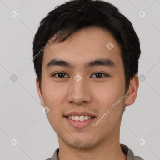 Joyful white young-adult male with short  black hair and brown eyes