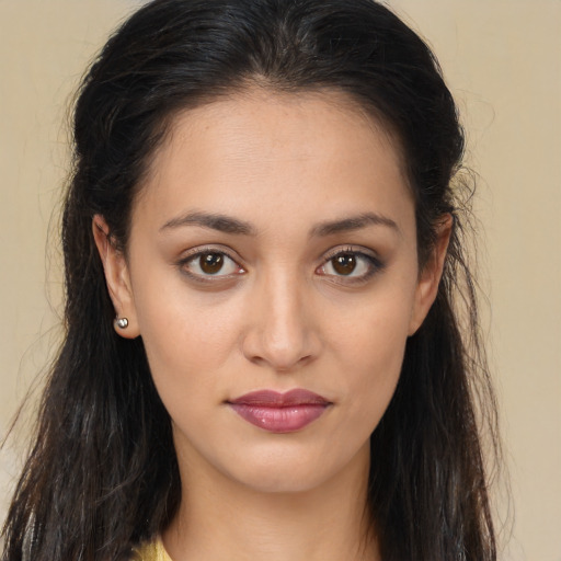 Joyful white young-adult female with long  brown hair and brown eyes