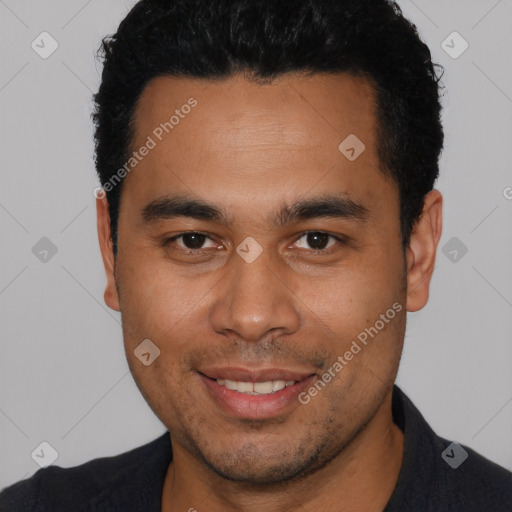 Joyful latino young-adult male with short  black hair and brown eyes