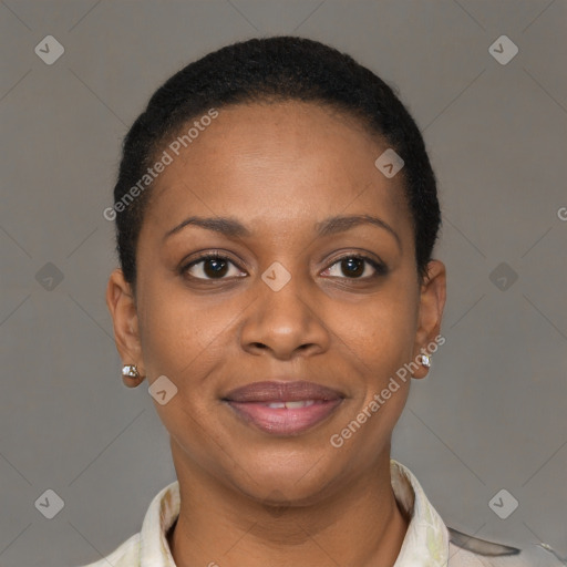 Joyful black young-adult female with short  brown hair and brown eyes