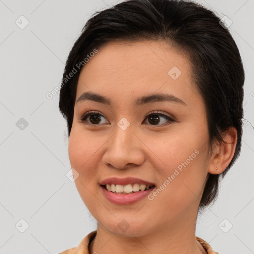 Joyful latino young-adult female with medium  brown hair and brown eyes