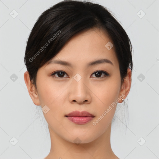 Joyful asian young-adult female with medium  black hair and brown eyes