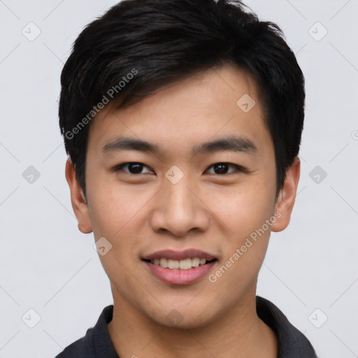 Joyful asian young-adult male with short  black hair and brown eyes