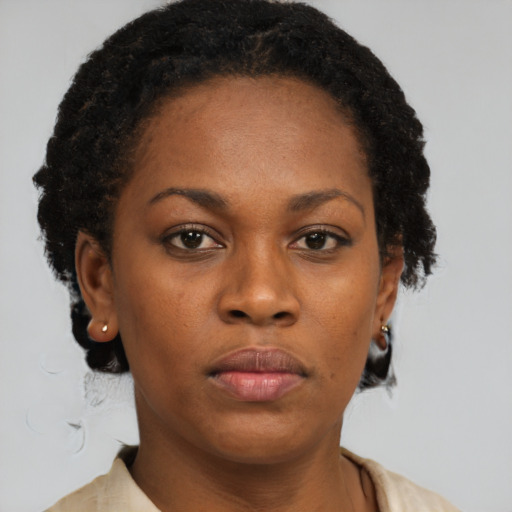 Neutral black young-adult female with short  brown hair and brown eyes