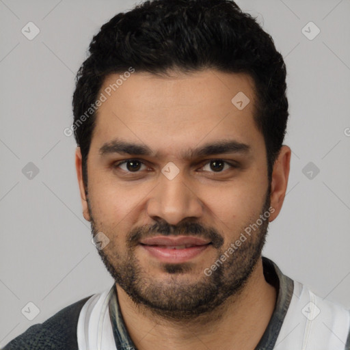 Joyful latino young-adult male with short  black hair and brown eyes