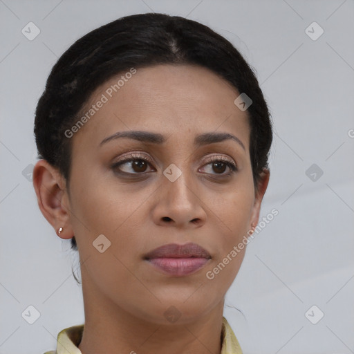 Joyful latino young-adult female with short  brown hair and brown eyes
