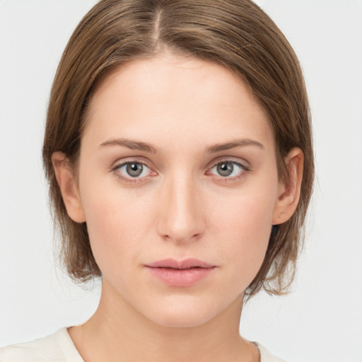 Neutral white young-adult female with medium  brown hair and blue eyes