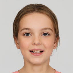 Joyful white child female with medium  brown hair and brown eyes