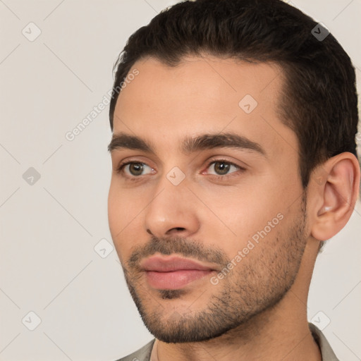 Joyful white young-adult male with short  brown hair and brown eyes