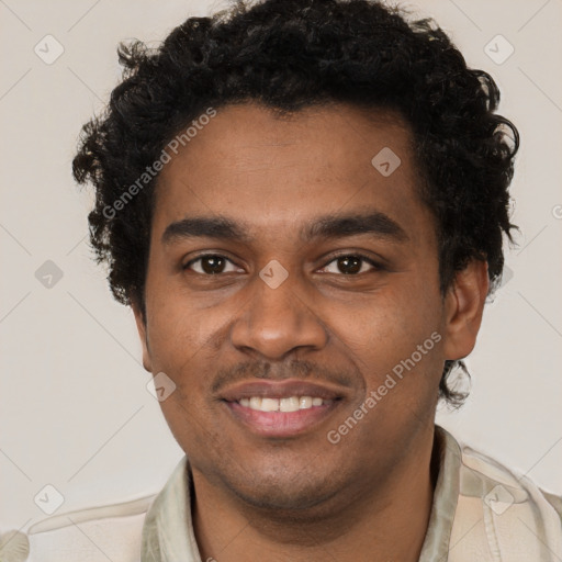 Joyful black young-adult male with short  brown hair and brown eyes