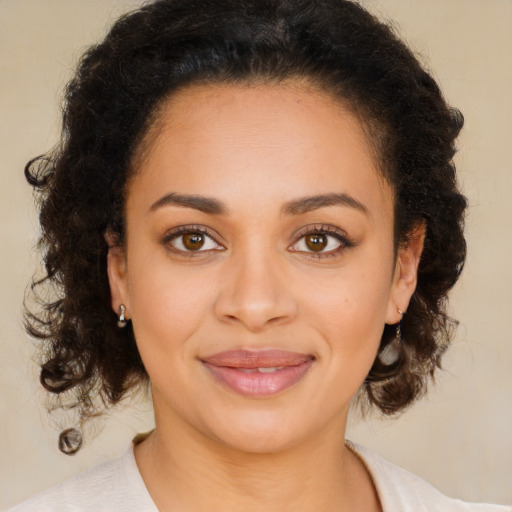 Joyful latino young-adult female with medium  brown hair and brown eyes