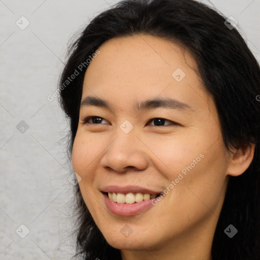 Joyful asian young-adult female with long  brown hair and brown eyes