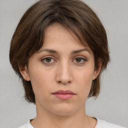 Neutral white young-adult female with medium  brown hair and green eyes