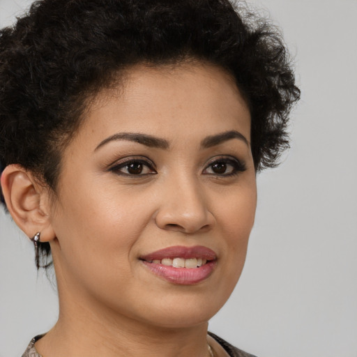 Joyful latino young-adult female with short  brown hair and brown eyes