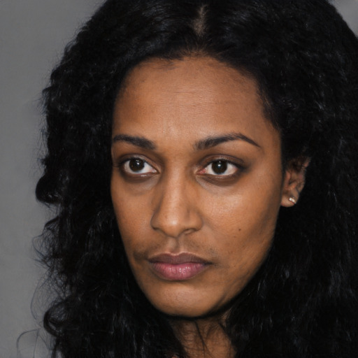 Neutral black young-adult female with long  black hair and brown eyes