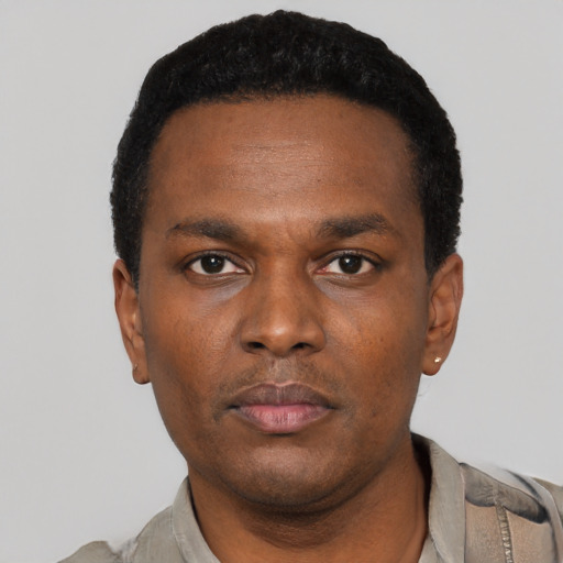 Neutral black young-adult male with short  black hair and brown eyes