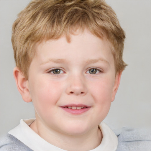 Joyful white child male with short  brown hair and grey eyes