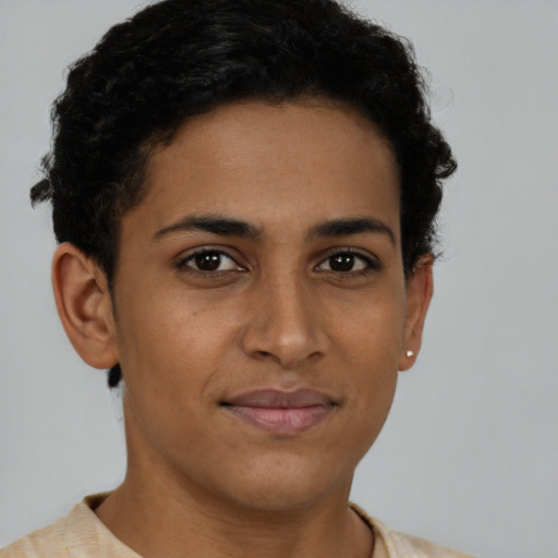 Joyful latino young-adult female with short  brown hair and brown eyes