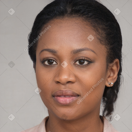 Joyful black young-adult female with medium  black hair and brown eyes