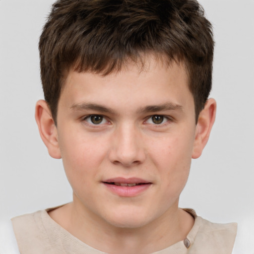 Joyful white child male with short  brown hair and brown eyes